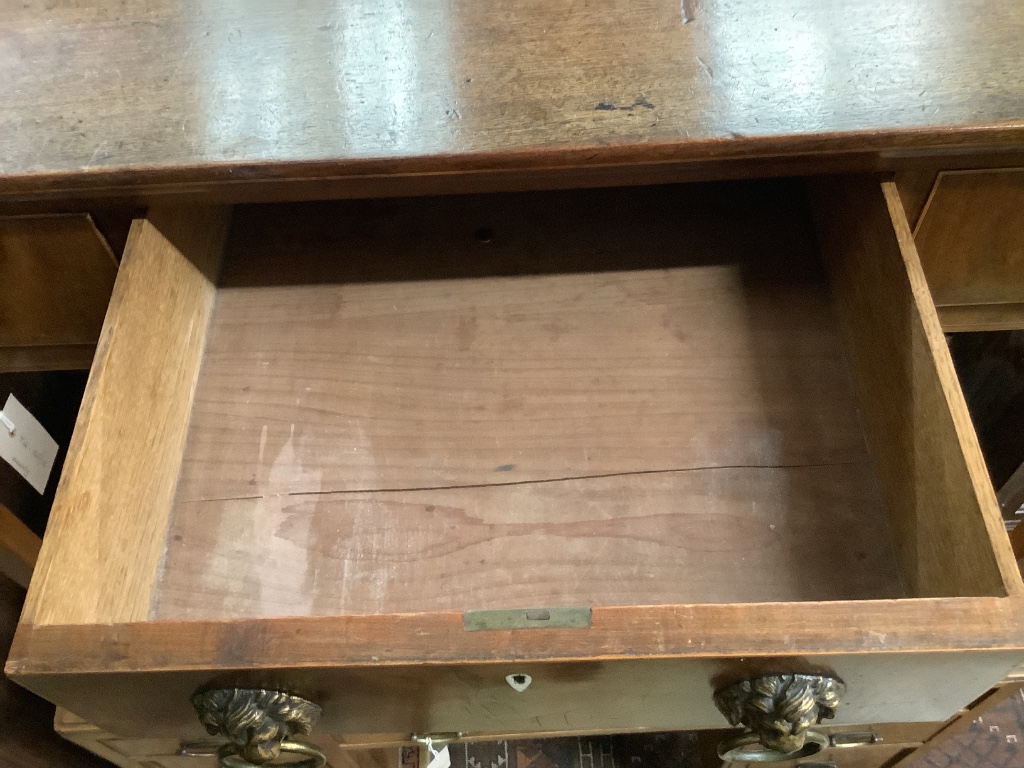 A George III mahogany side table, having three-quarter galleried top over three short drawers on tapered legs, width 95cm depth 51cm height 77cm